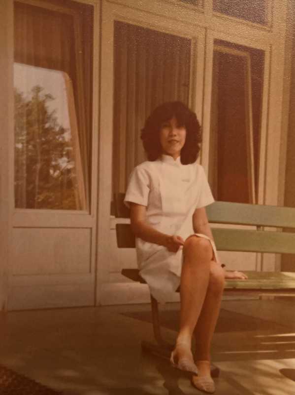 WIENWOCHE 2023: Sulyap. An archival image of Ophelia Cortez in white uniform sitting in front of a window. © Chelsea Amada